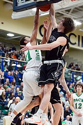 Flathead's Cooper Smith (20) and Gabe Adams (13) block a layup attempt by Glacier's Anthony Heath (21) during a crosstown matchup at Glacier High School on Friday. (Casey Kreider/Daily Inter Lake)