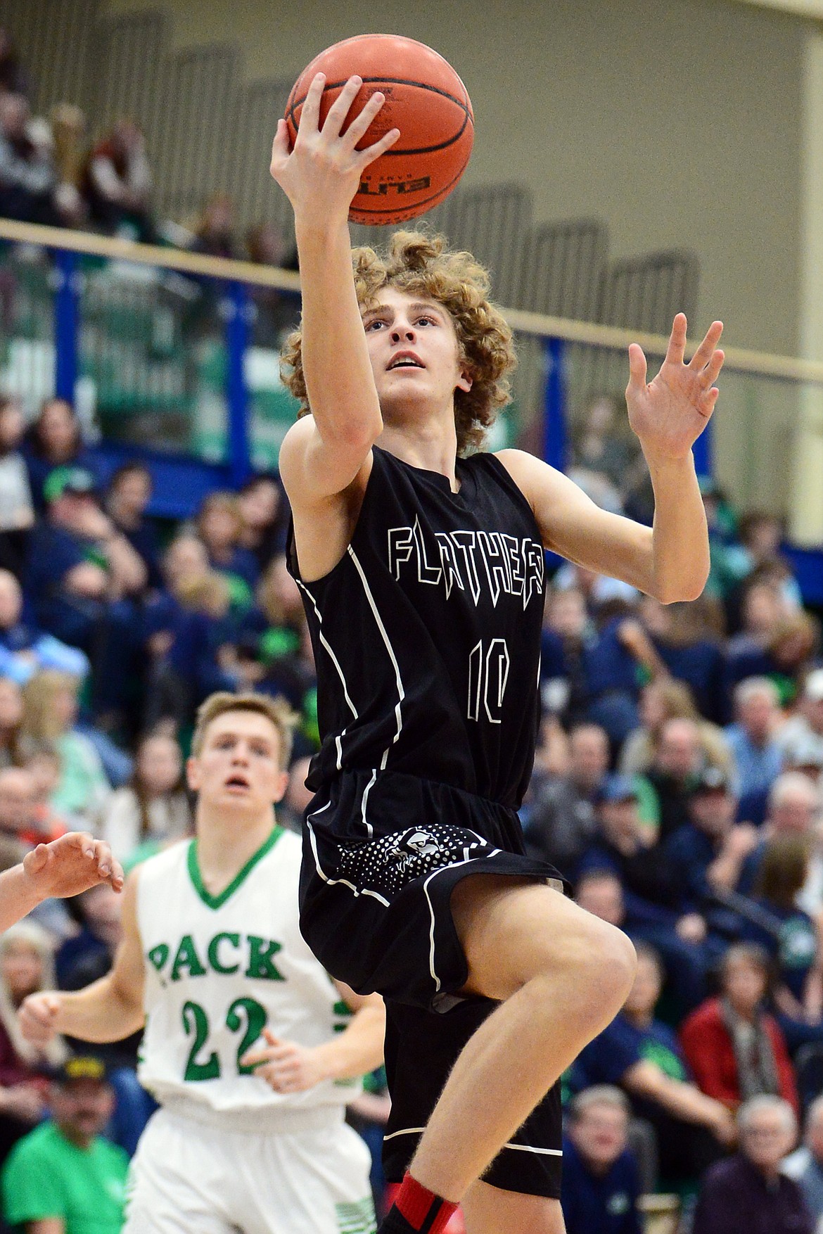 Flathead's Hunter Hickey (10) drives to the basket against Glacier during a crosstown matchup at Glacier High School on Friday. (Casey Kreider/Daily Inter Lake)