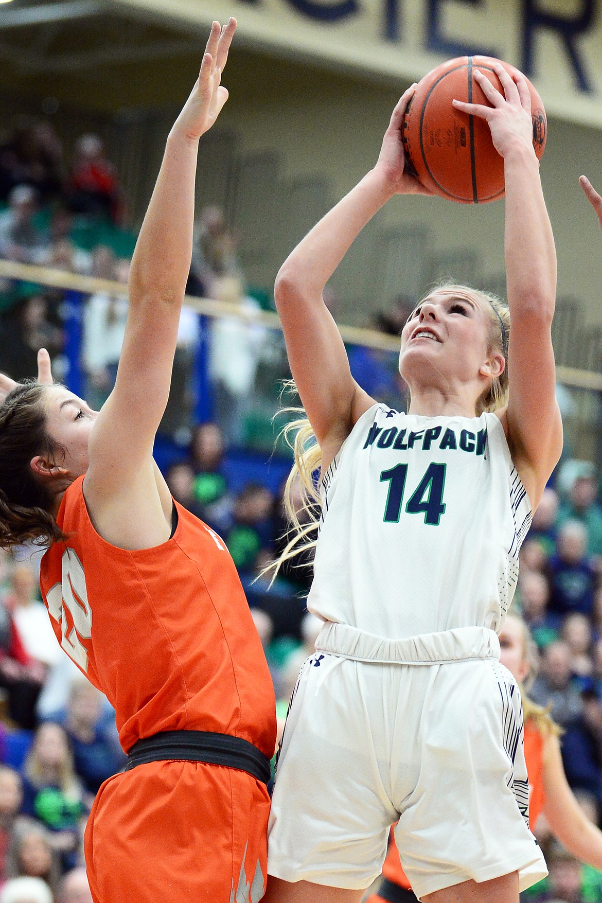 Glacier's Aubrie Rademacher (14) looks to shoot against Flathead's Bridget Crowley (20) during a crosstown matchup at Glacier High School on Friday. (Casey Kreider/Daily Inter Lake)
