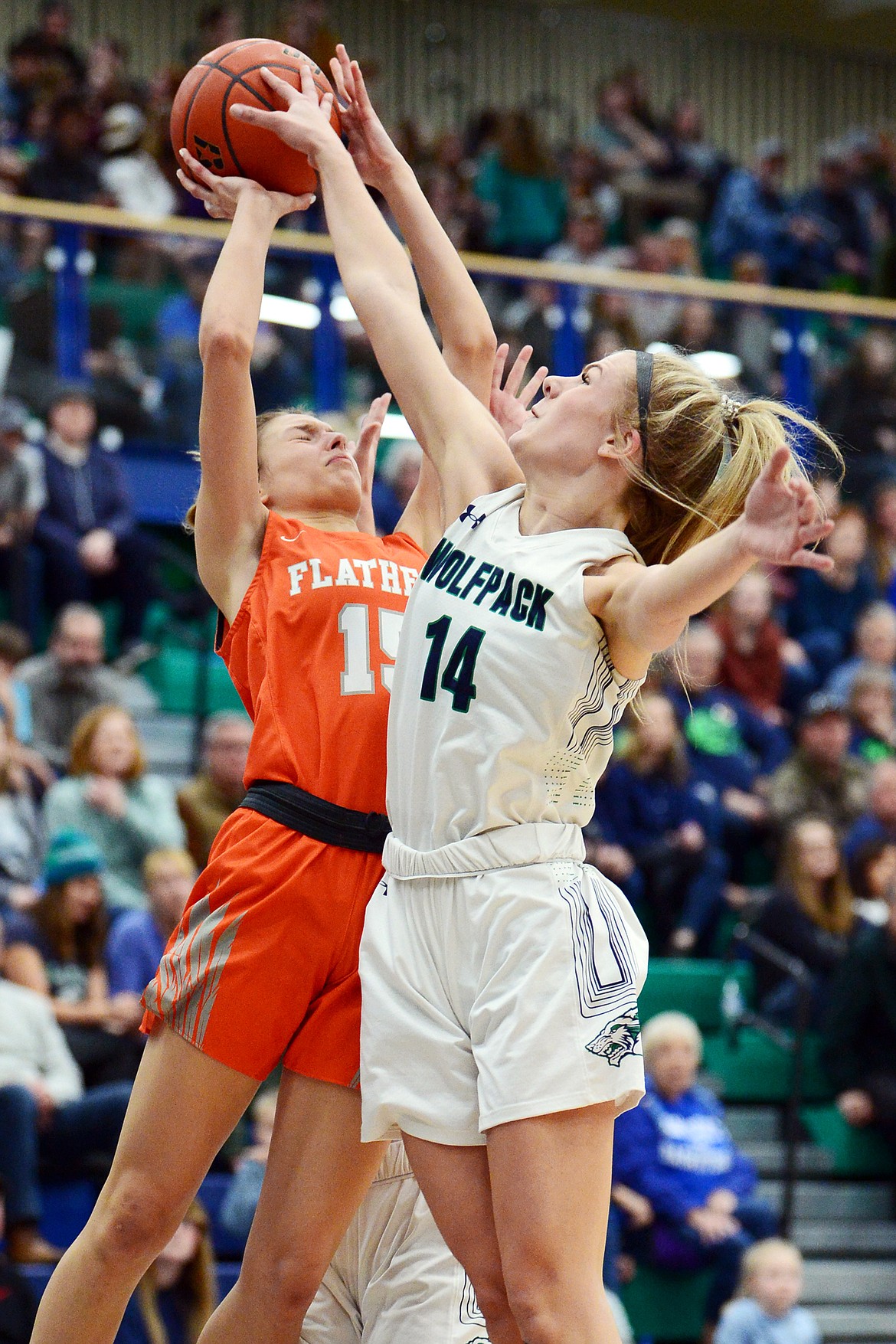 Glacier's Aubrie Rademacher (14) blocks the shot of Flathead's Clare Converse (15) during a crosstown matchup at Glacier High School on Friday. (Casey Kreider/Daily Inter Lake)
