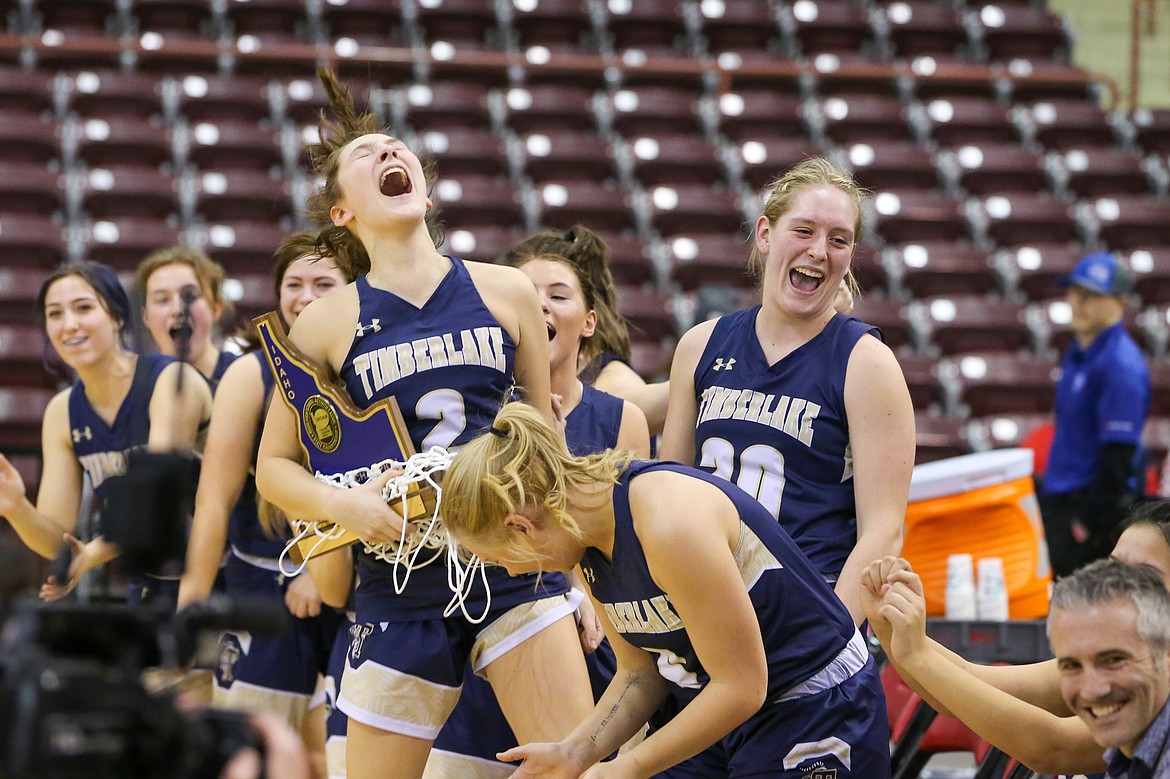 Photo by JASON DUCHOW PHOTOGRAPHY
Timberlake players erupt in laughter as coach Matt Miller thanks his wife and assistant coach, Molly Miller, following the Tigers’ win over Snake River in the state 