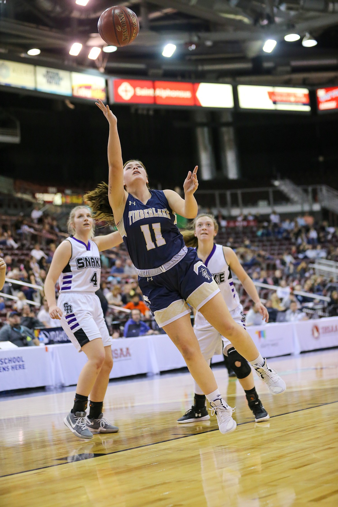Photo by JASON DUCHOW PHOTOGRAPHY 
 Bernie Carhart of Timberlake puts up a shot against Snake River in the state 3A girls championship game Saturday at the Ford Idaho Center in Nampa.