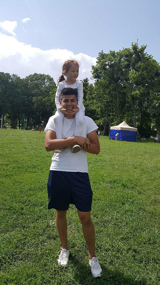 Kuzhel plays with Mariah, the daughter of a friend, at a park near the Ukrainian city of Chernivtsi.