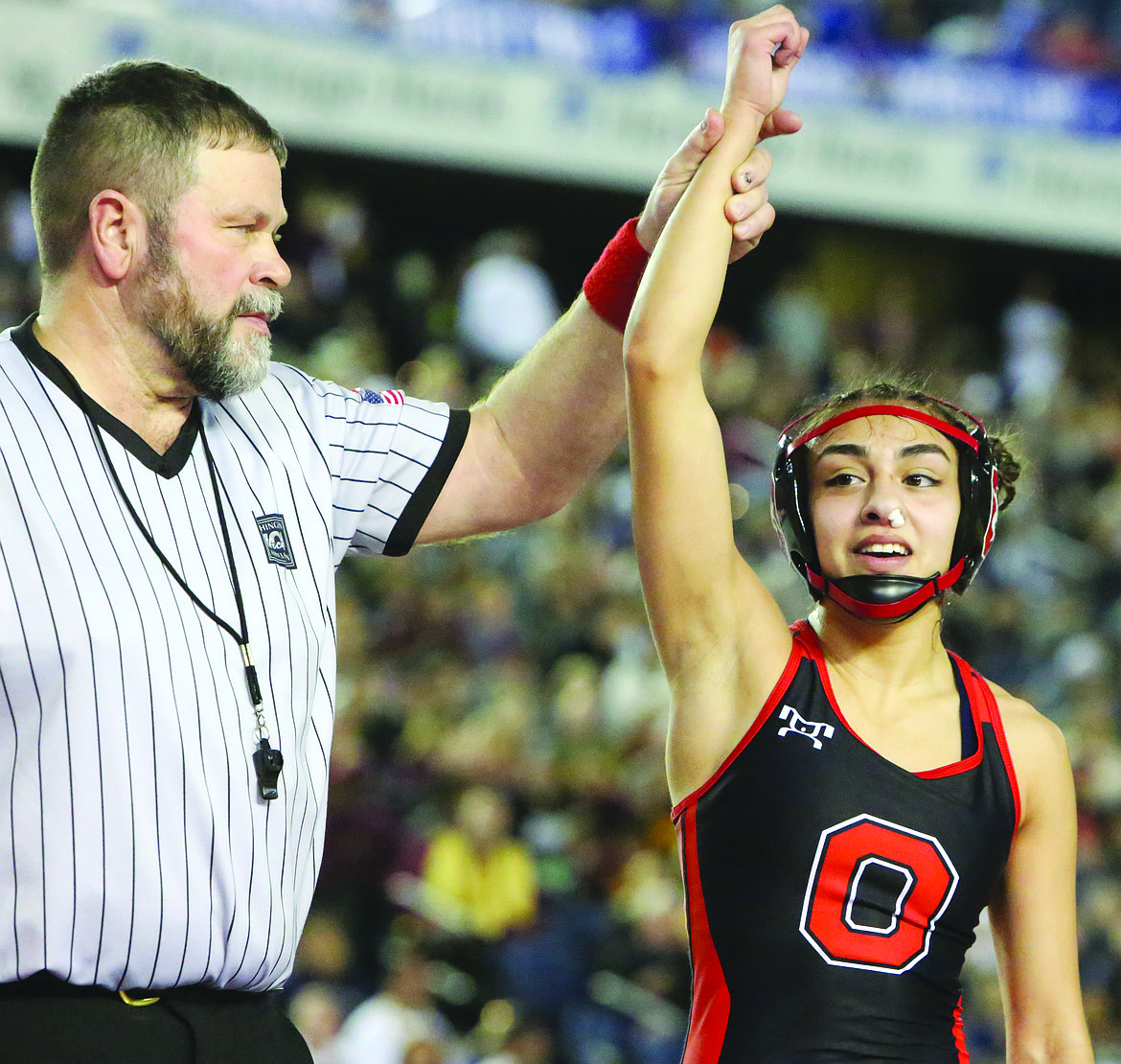 Connor Vanderweyst/Columbia Basin Herald 
 Othello's Emily Mendez has her arm raised after winning the 110-pound state championship.