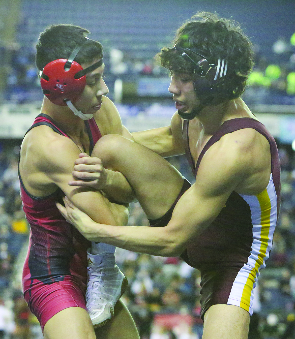 Connor Vanderweyst/Columbia Basin Herald 
 Moses Lake's Jonathan Tanguma (right) tries to free his leg from Sunnyside's Alejandro Fernandez during the 113-pound state semifinals.