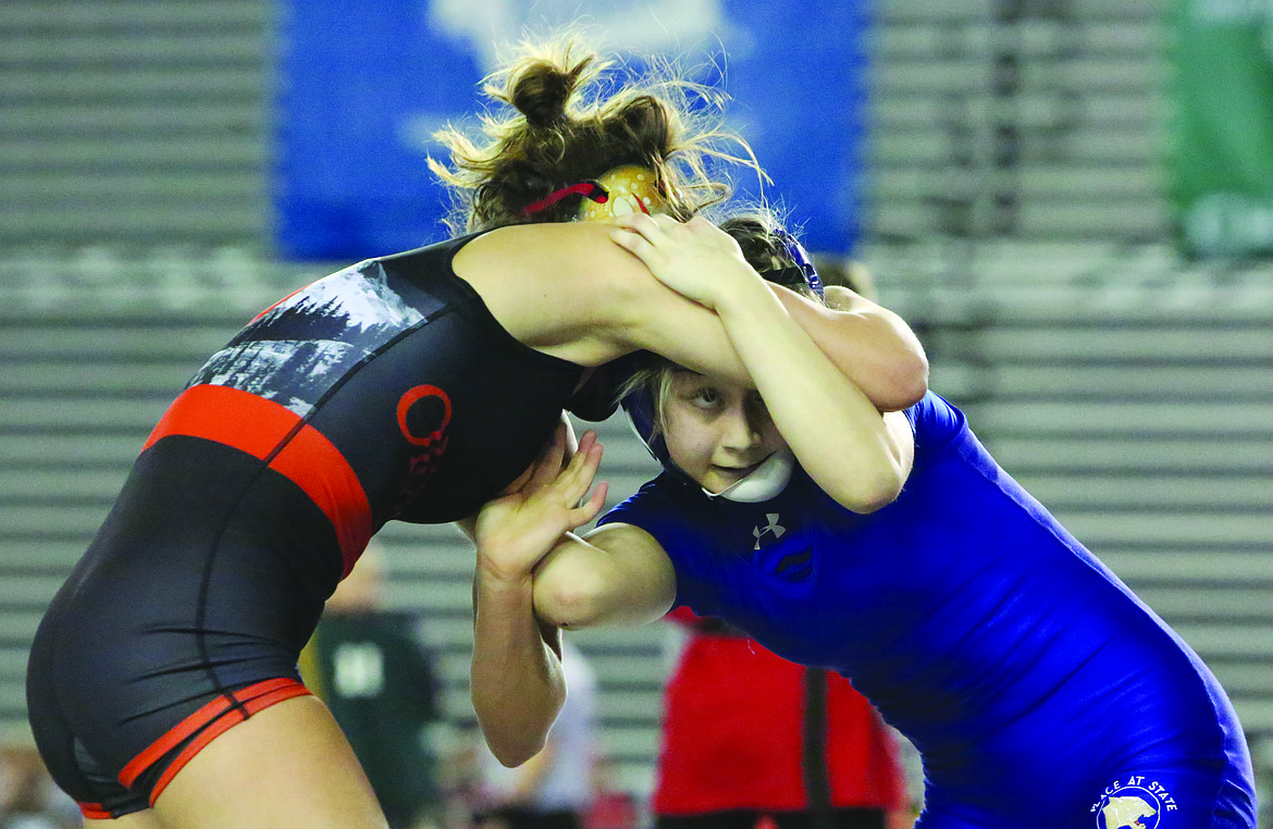 Connor Vanderweyst/Columbia Basin Herald 
 Warden's Aaliyah Escamilla (right) grapples with Orting's Ava Fritz during a semifinals match at Mat Classic XXXII.