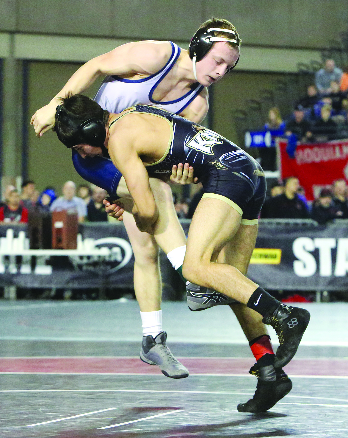 Connor Vanderweyst/Columbia Basin Herald 
 Royal's Dominic Martinez takes down Forks' Jake Weakley during the 132-pound state semifinals.