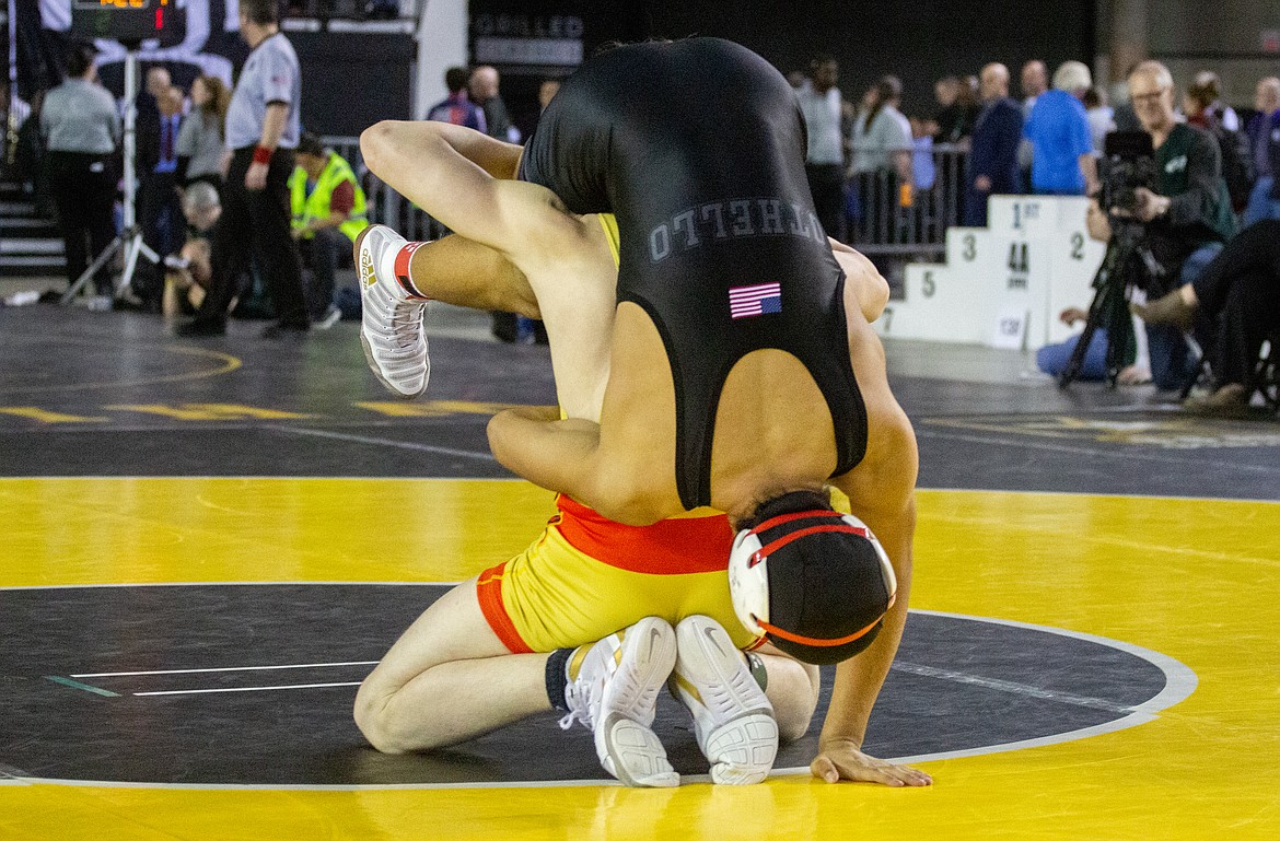 Casey McCarthy/Columbia Basin Herald Othello's Arturo Solorio tries to prevent the slam by his opponent in his championship bout at the Mat Classic in Tacoma on Saturday.