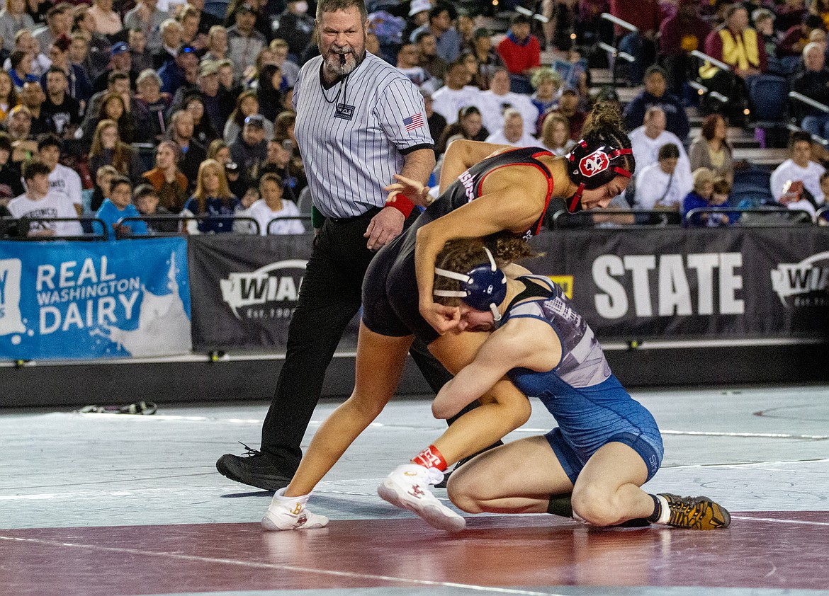 Casey McCarthy/Columbia Basin Herald Emily Mendez overpowers her opponent as she moves on to claim the title at 110 pounds on Saturday in Tacoma.