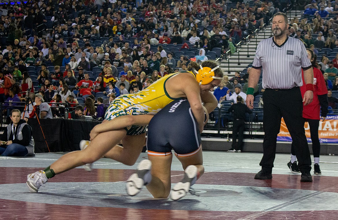 Casey McCarthy/Columbia Basin Herald Quincy's Shannon Workinger works to take her opponent from Kennewick to the mat in a rematch from the finals at regionals a week before in Tacoma on Saturday.