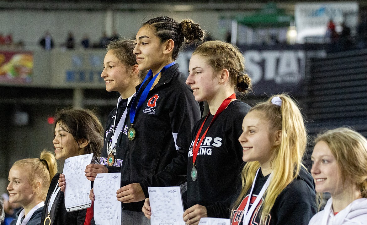 Casey McCarthy/Columbia Basin Herald Othello's Emily Mendez (top of podium) took first at 110, while fellow Huskie Alexis Monday (second from right) placed fourth in the same division.