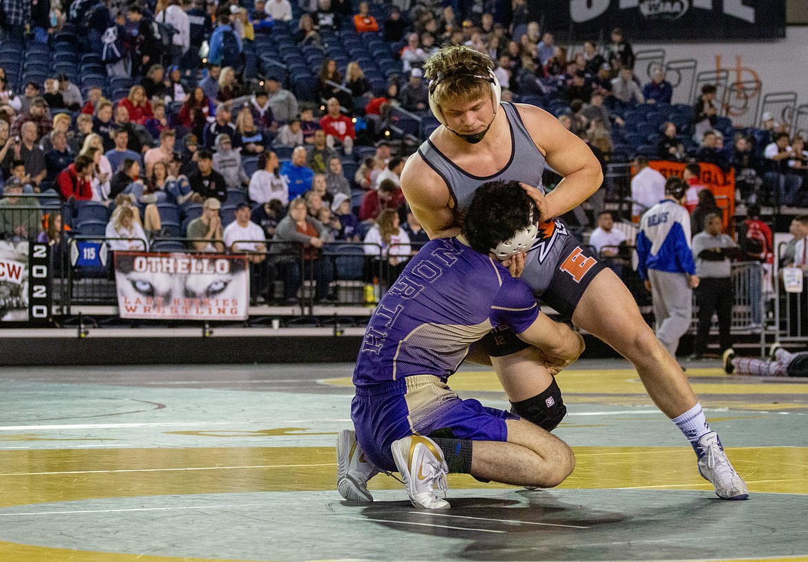 Casey McCarthy/Columbia Basin Herald Ephrata's Mac Laird grounds himself against North Kitsap's Nouh Hammou as the senior Tiger went on to claim his first title after finishing second in 2019.