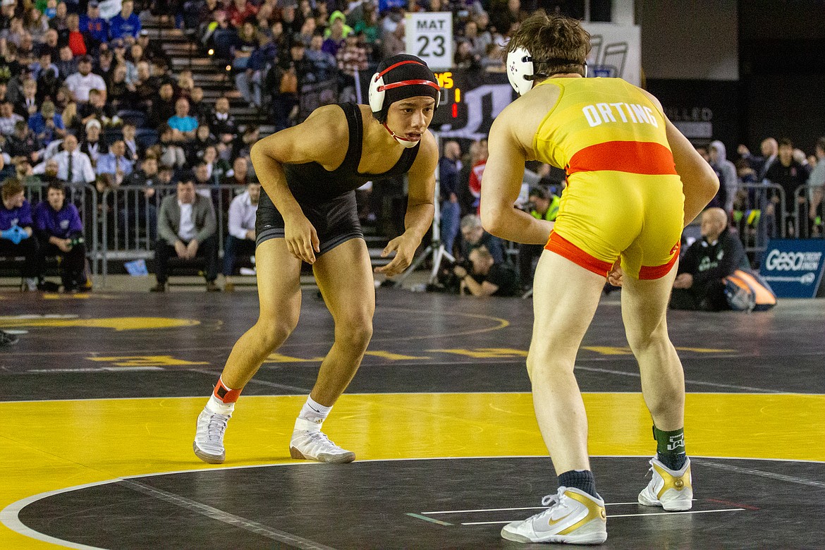Casey McCarthy/Columbia Basin Herald Othello's Arturo Solorio faced off against Orting's Seth Dawkins in the finals at 145 in the Tacoma Dome on Saturday.