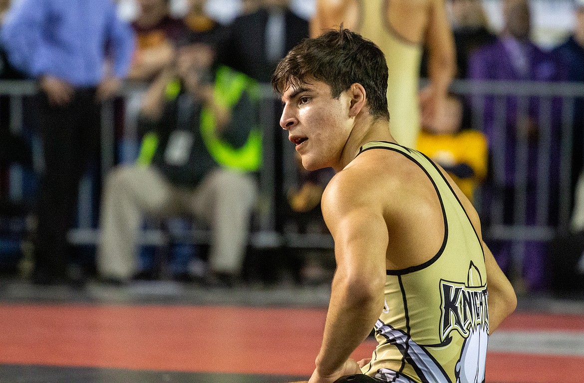 Casey McCarthy/Columbia Basin Herald Royal's Dominic Martinez takes a moment before getting up from the mat after falling in the championship round at 132 pounds at Mat Classic XXXII on Saturday.