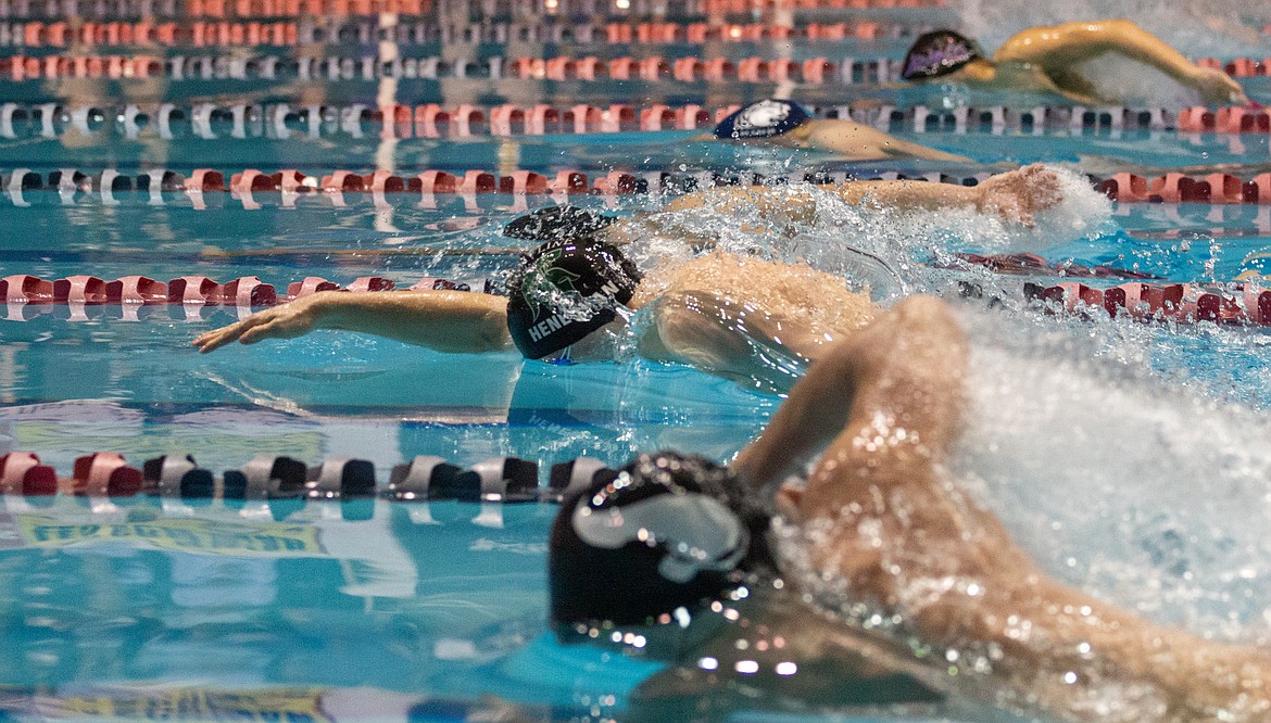 Casey McCarthy/Columbia Basin Herald 4A swimmers make their final push in the last leg of the 100-yard freestyle finals on Saturday morning at King County Aquatic Center.