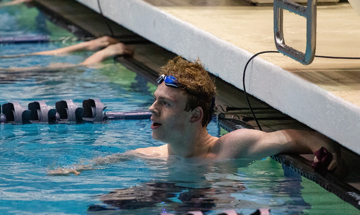 Casey McCarthy/Columbia Basin Herald Senior Dylan Bond looks up to check his time after the consolation finals in the 100-yard freestyle at the 4A state swim and dive meet on Saturday.