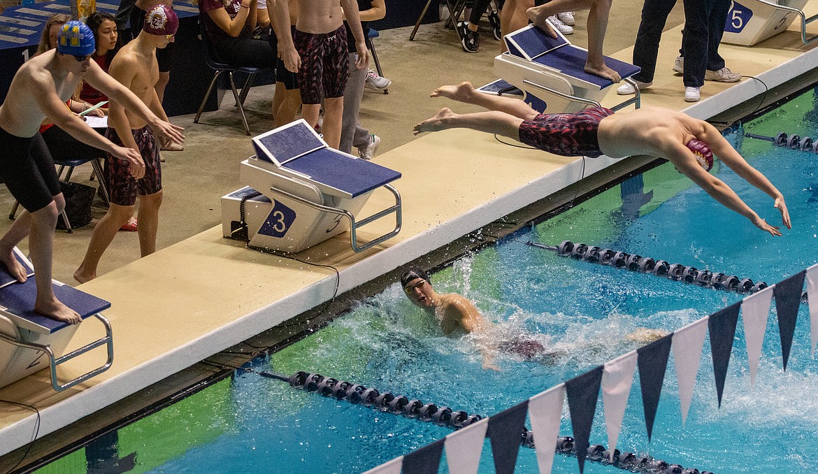 Casey McCarthy/Columbia Basin Herald Members of the Moses Lake 200-yard freestyle relay grabbed the top finish in the consolation finals on Saturday at the 4A state finals.