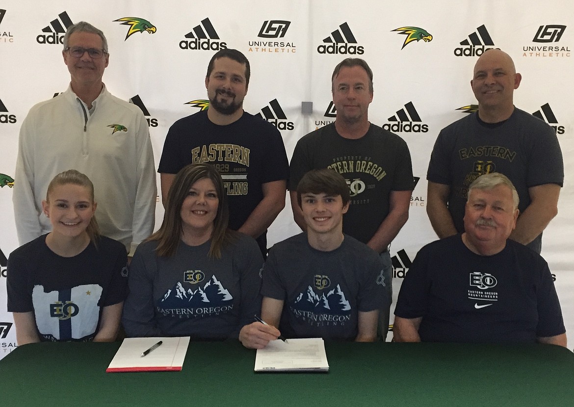 Lakeland High senior Alex Edelblute recently signed a letter of intent to wrestle at NAIA Eastern Oregon University in La Grande. Seated from left are Cheyenne Friddle, Heather House, Alex Edelblute and Walt Edelblute; and standing from left, Mike Divilbiss, Lakeland High athletic director; Zach Horsley, Lakeland High assistant wrestling coach; Rob Edelblute, Lakeland High head wrestling coach; and Marty Walker.