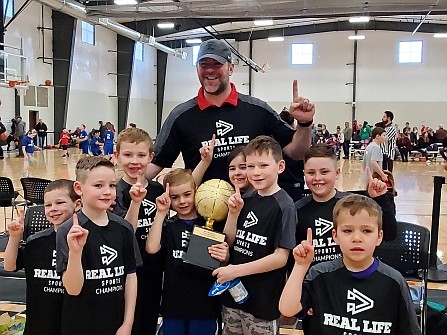 Courtesy photo 
 The Huskies won the 1st/2nd-grade championship in the Real Life Ministries basketball league. From left are Jaden Hoffman, Tate Torfin, Bobby Hunter, Palmer Murphy (holding trophy), 