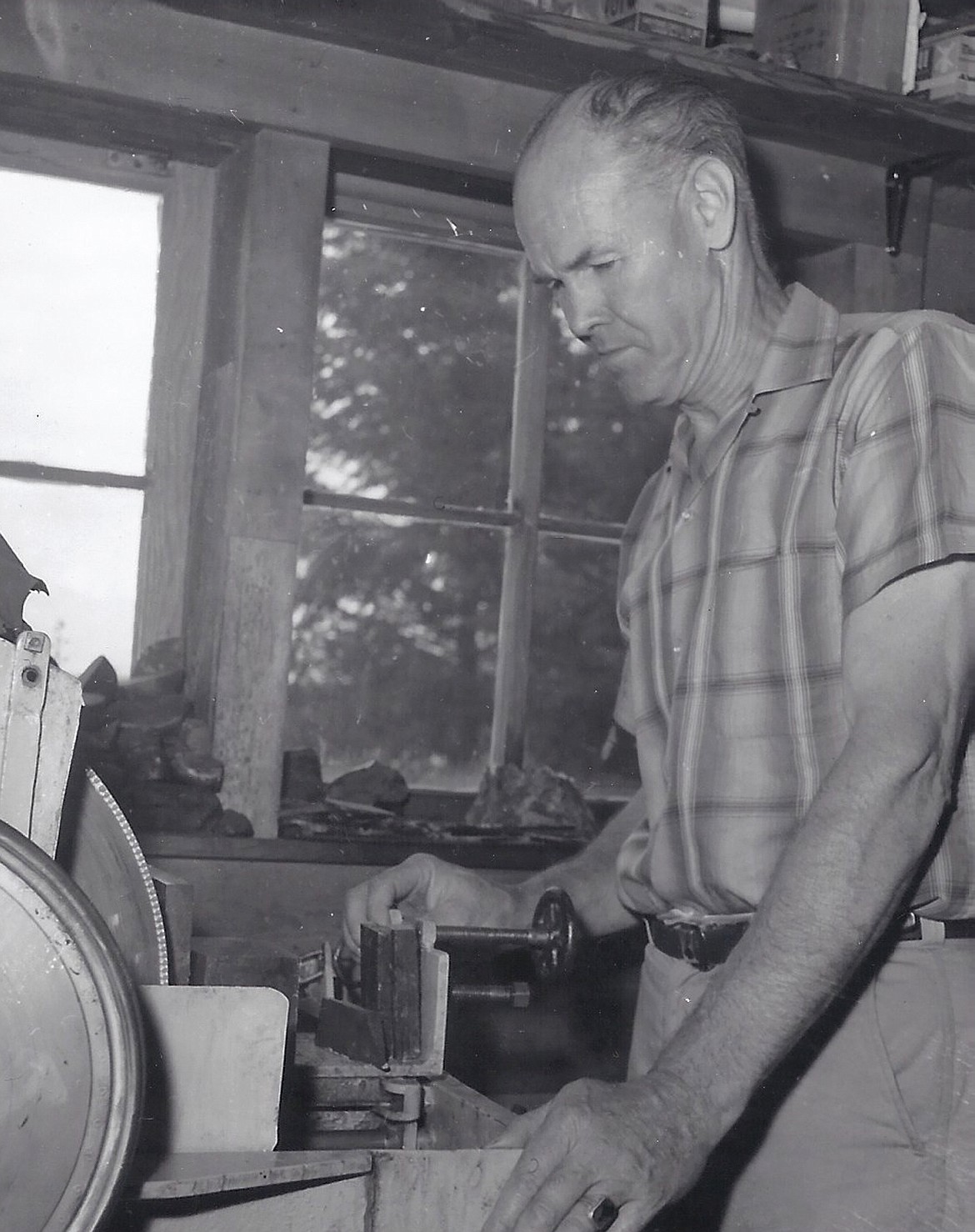 James “Jack” Kehoe working at the diamond blade “jade” saw he designed and built. Kehoe was one of the first people in the U.S. to cut and work with the jade from Canada.