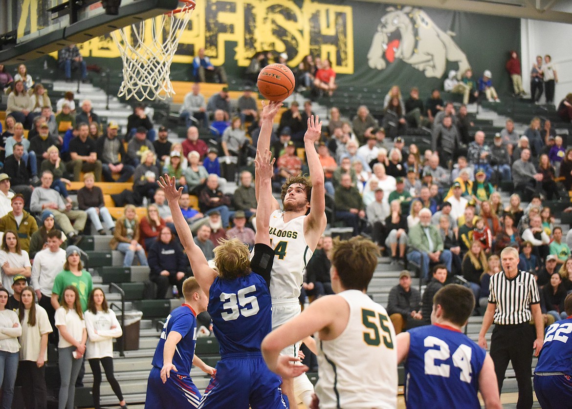 Sam Menicke puts up a floater during the Dogs’ Thursday night win over Columbia Falls. (Daniel McKay/Whitefish Pilot)