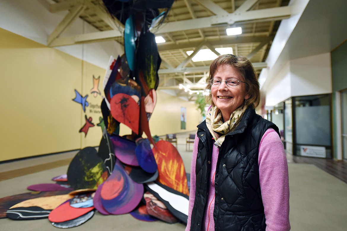 Artist Jennifer Thompson stands before her work titled “Aspects of the Broken Heart” at the Gateway Community Center in Kalispell on Friday, Feb. 21. (Casey Kreider/Daily Inter Lake)