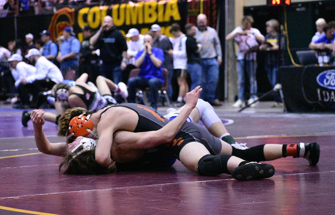 Braxton Mason of Post Falls has Noah Gluck of Timberline on his back during their state 5A 120-pound quarterfinal match Friday at the Ford Idaho Center in Nampa. Mason won 10-7 to advance to the semifinals.