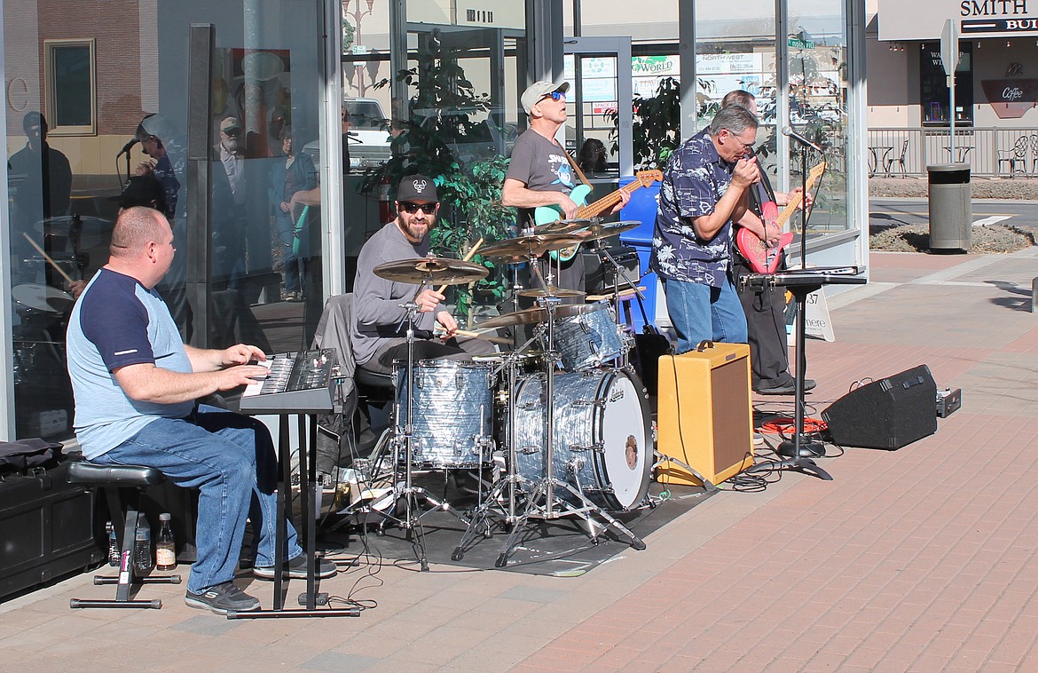 Joel Martin/Columbia Basin Herald 
 Lake City Blues makes it wail on the sidewalk outside Windermere Real Estate on Third Avenue Saturday. The Moses Lake-based band was one of nine featured at Brews 
