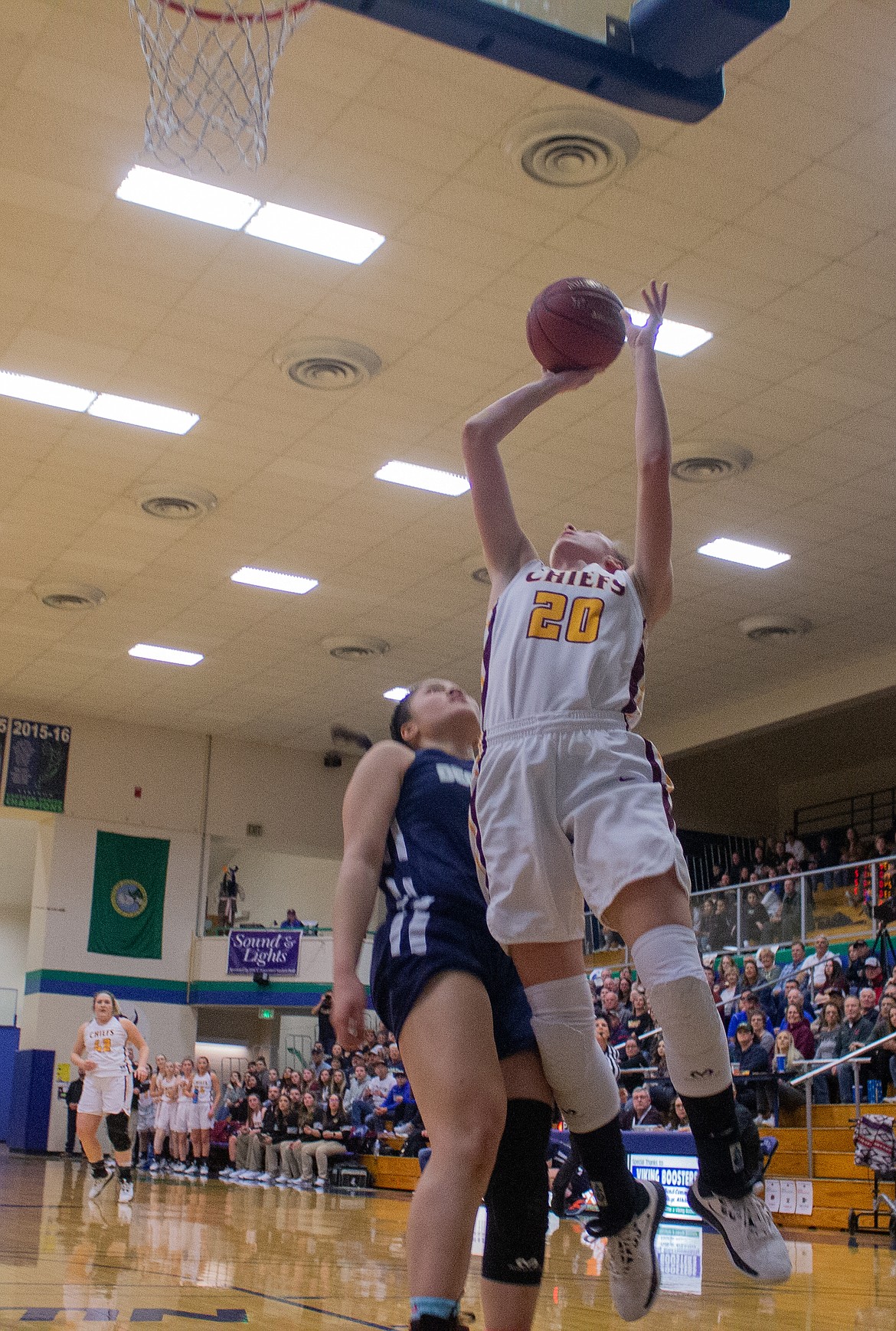 Casey McCarthy/Columbia Basin Herald Camille Carpenter fires the shot from under the basket as she rises above the Decatur defender at Big Bend on Saturday afternoon.