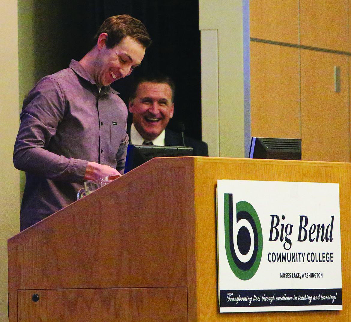 Connor Vanderweyst/Columbia Basin Herald 
 Former Big Bend baseball player Dylan Signorelli (foreground) and athletic director Mark Poth share a laugh during the college's Hall of Fame banquet.
