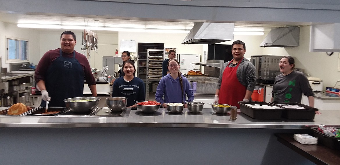 Members of the Northwest Indian Bible School senior class are ready to make Indian tacos recently. Their profit for this day was more than $600 which will go toward their spring break trip to Seattle. The next Indian Taco sale is March 16. (Monte Turner/Mineral Independent)