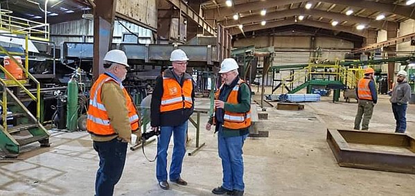 Idaho Forest Group’s Willy Peck, Montana House District 14 Representative Denley Loge and Montana Attorney General Tim Fox talk about the importance of the timber industry to local people in Northwest Montana during Fox’s recent campaign swing through Northwest Montana. Fox is running for governor. (Courtesy photo)