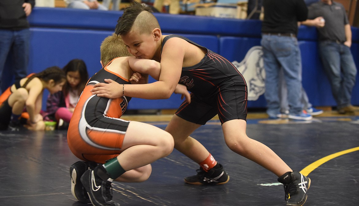Arlee’s Brayden Marks tangles with a Frenchtown wrestler at last Saturday’s Little Guy tournament at St. Ignatius High School. (Scott Shindledecker/Lake County Leader)