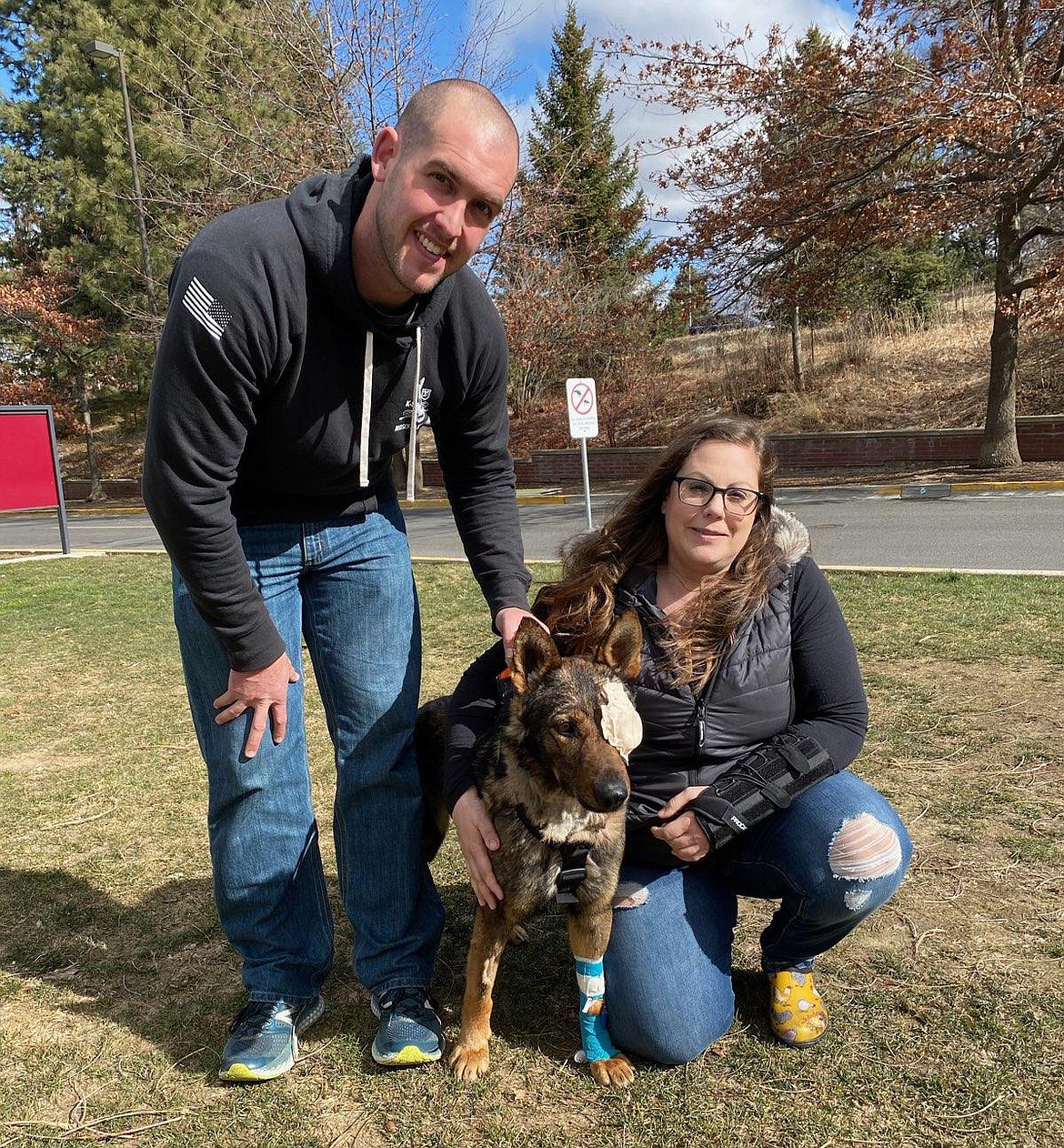 Dr. Jesyka Morrison, right, of Pioneer Veterinary Clinic, sits Wednesday with Chief and Officer Nick Stewart, left, for the first time since she rode with him on a Life Flight plane Friday.