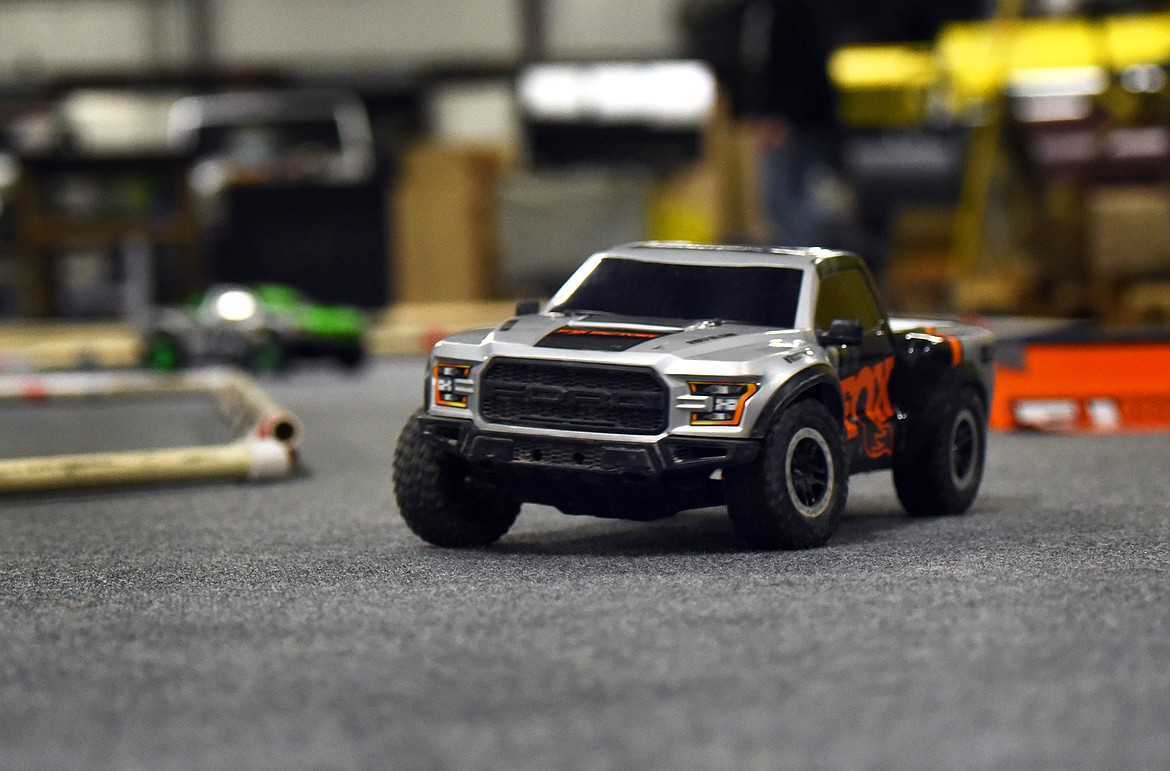 AN RC racer vecicle travels the
course during practice at Glacier
Steel Roofing Products.
