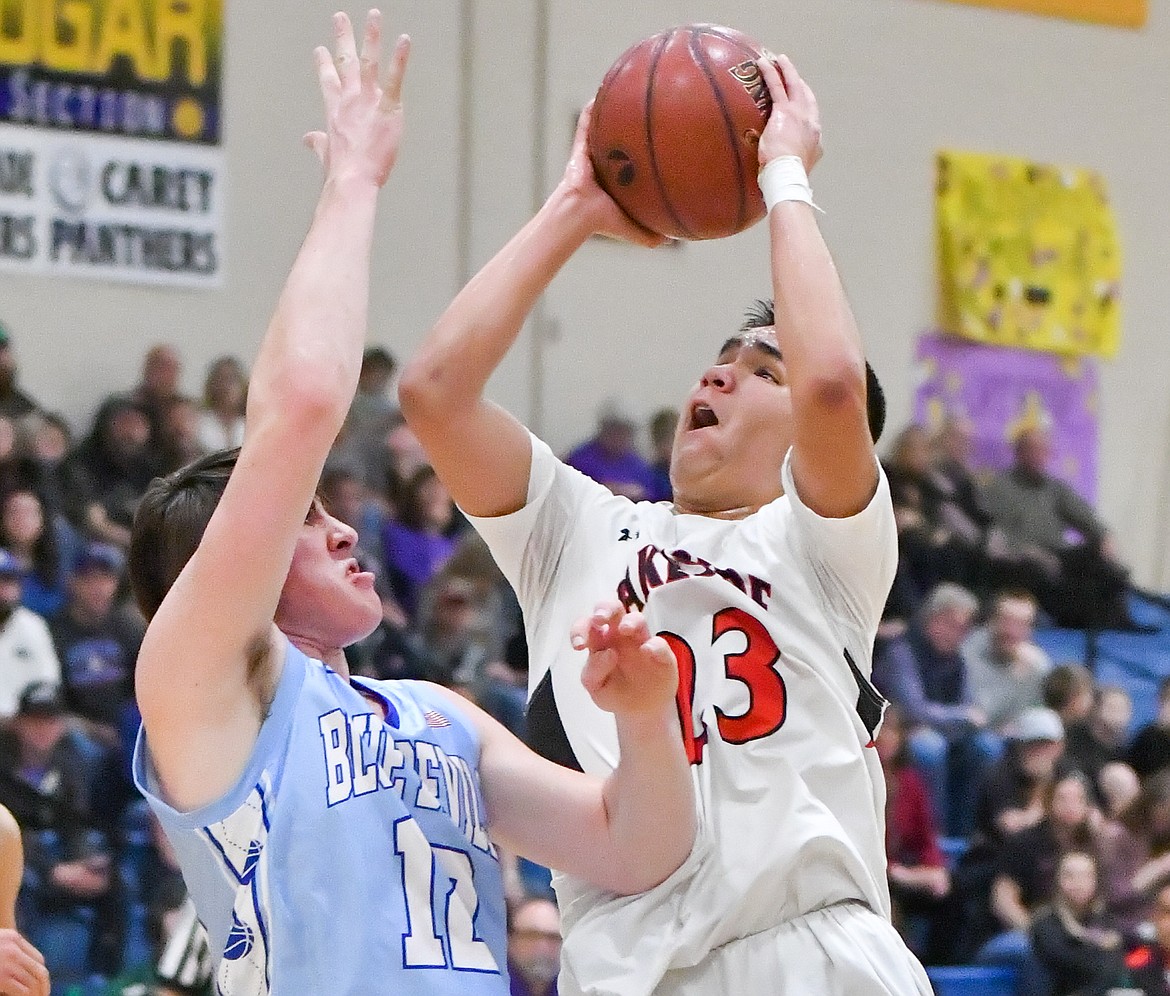 Lakeside’s Talon Twoteeth (23) puts up a shot over Dietrich’s Kyler Robertson (12) in their state 1A Division II game at Caldwell High on Friday.