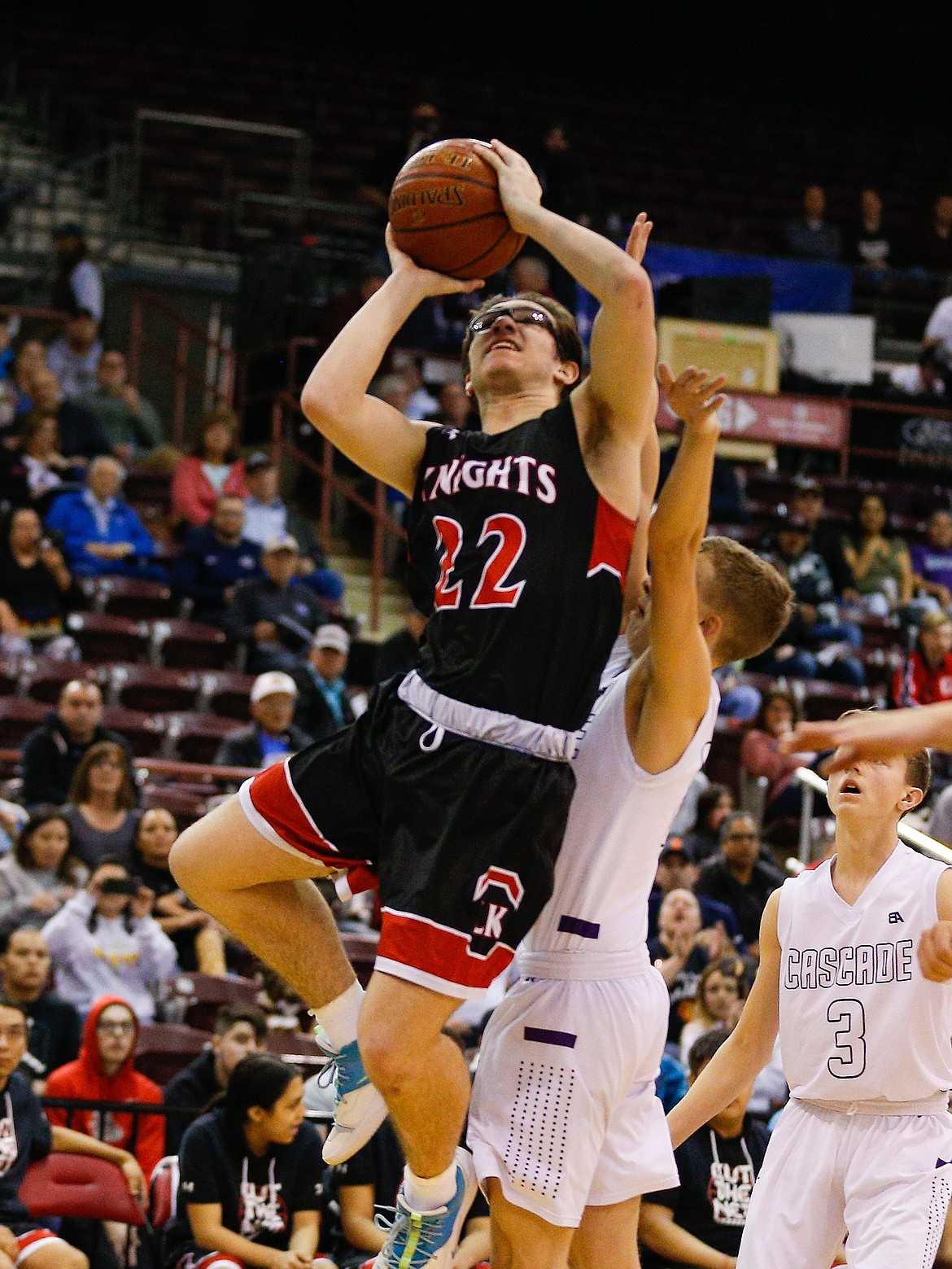 STEVE CONNER/Special to the Press
Lakeside’s Jayson Hall (22) goes to the basket against tough Cascade defense in the state 1A Division II boys basketball championship game in the final seconds against Cascade at the Ford Idaho Center in Nampa.