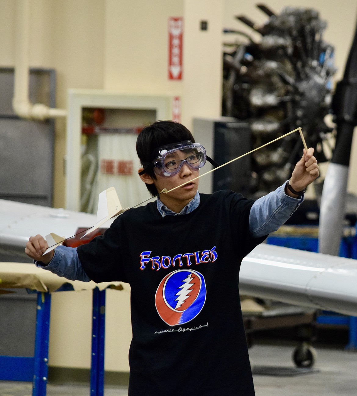 Frontier Middle School student Makoto Miura prepares to launch the glider he and fellow student Aiden Mann built as part of the Science Olympiad competition at Big Bend Community College on Saturday.