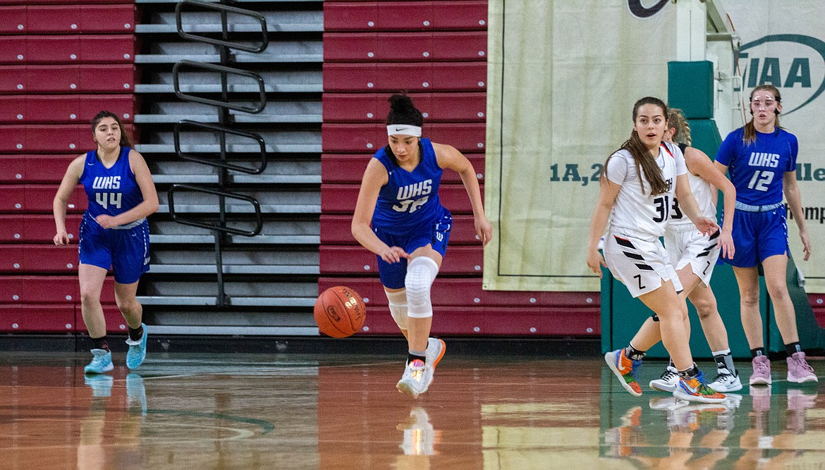 Casey McCarthy/Columbia Basin Herald 
 Sophomore Kiana Rios takes the ball up the court after the forced turnover by the Cougars in the second half of a 65-49 win over Zillah at the 1A state tournament in Yakima.