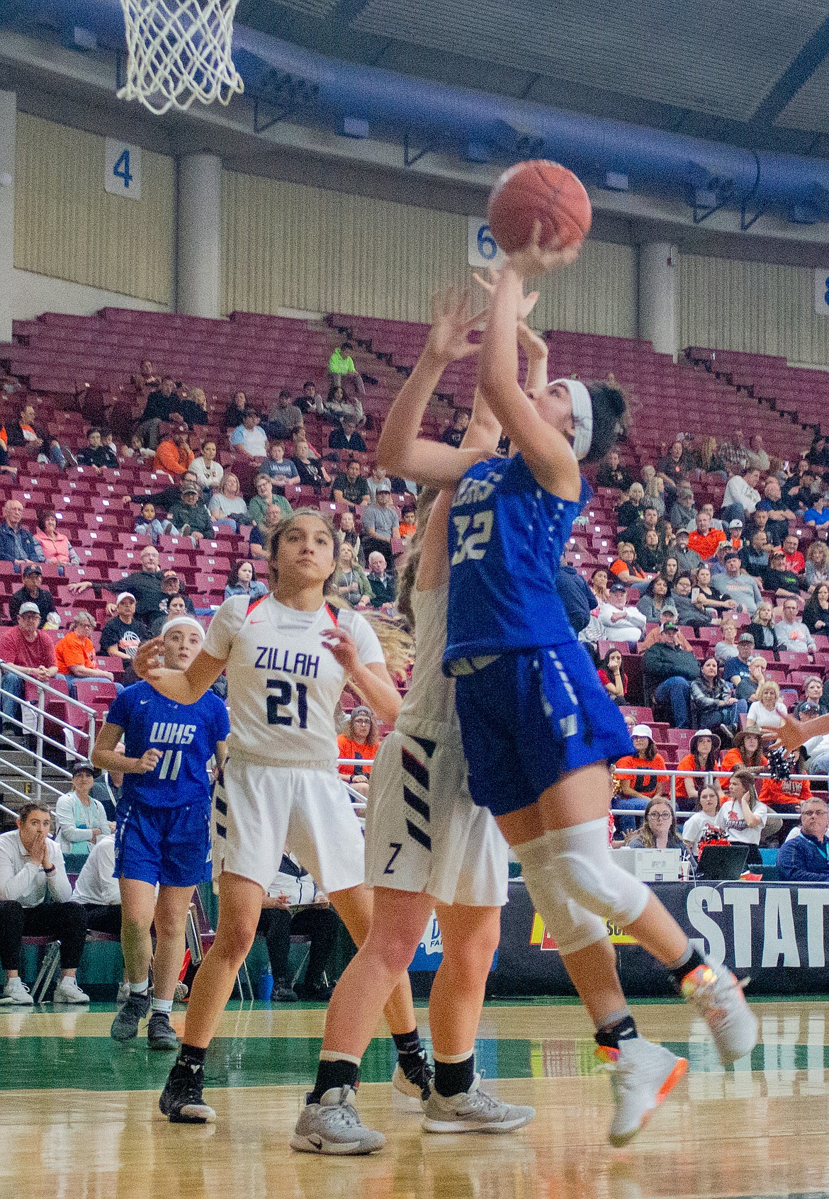 Warden sophomore Kiana Rios rises for the layup against the Zillah defender in the first half of a 65-49 win on Friday at the Yakima Valley SunDome.