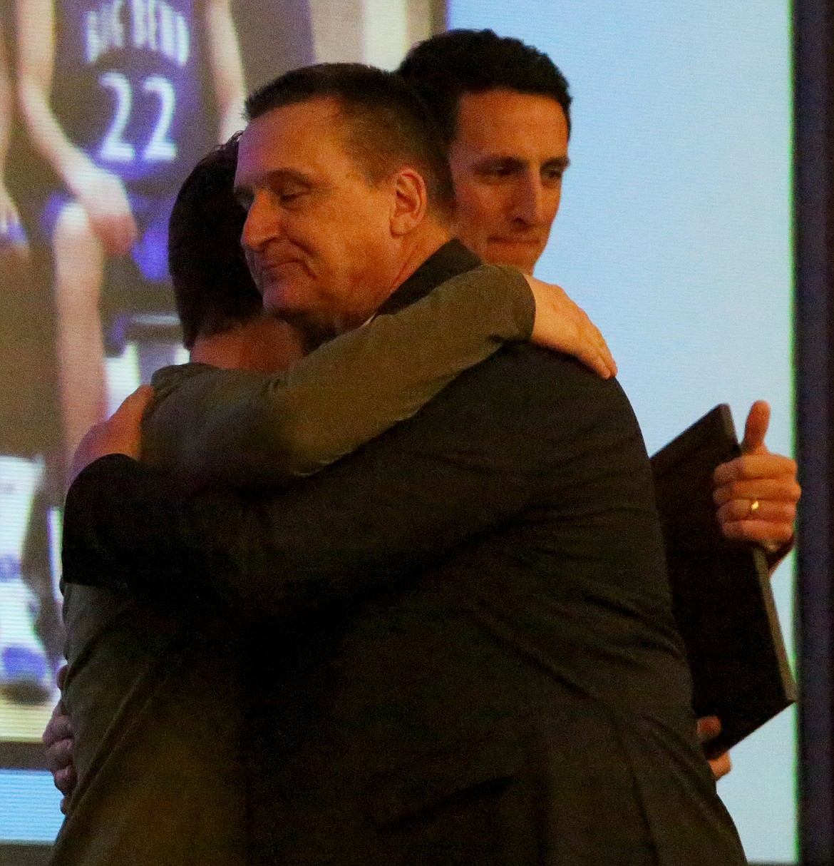 Mark Poth embraces former player and assistant coach Spencer Pingel at the Big Bend Hall of Fame banquet.