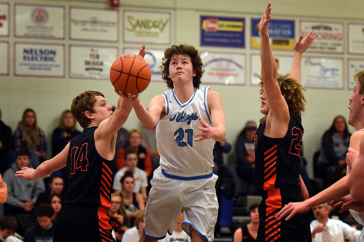 Isak Epperly goes up for a layup against Eureka Thursday. (Jeremy Weber/Bigfork Eagle)