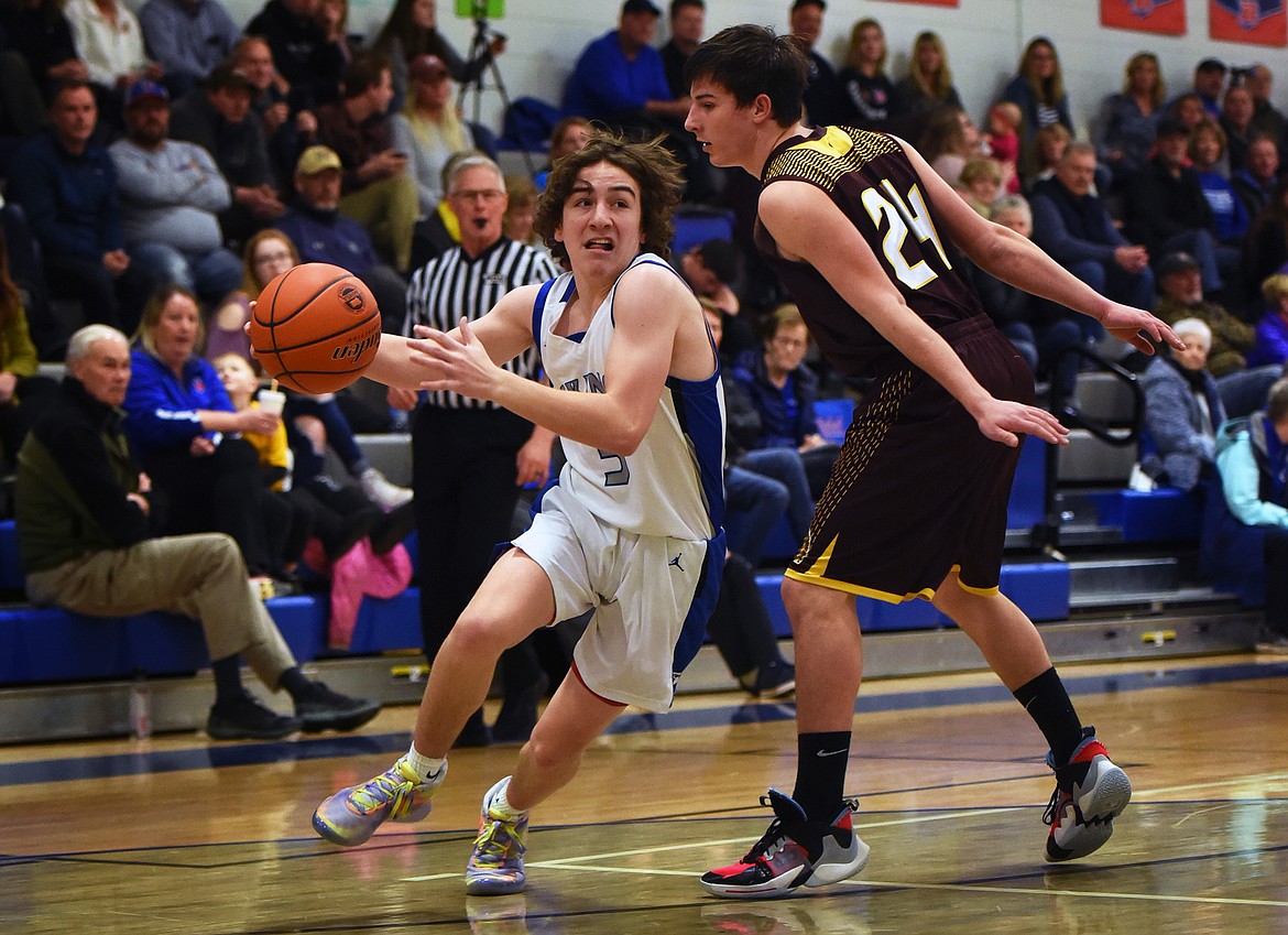 Bigfork’s Walker Fisher makes a move to the basket in the the third quarter against Troy Saturday. (Jeremy Weber/Bigfork Eagle)