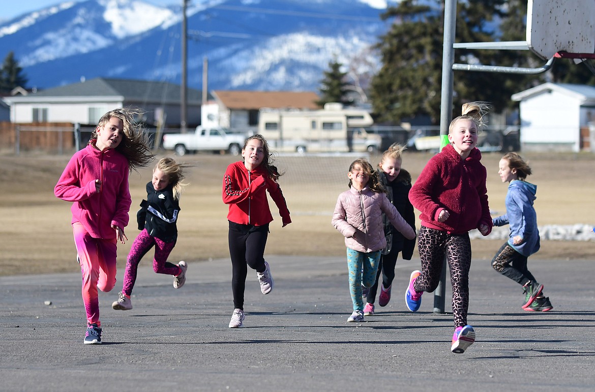 Third through fifth grade girls choose which way to run during an activity for Girls on the Run at Ruder Elementary last week. (Teresa Byrd/Hungry Horse News)