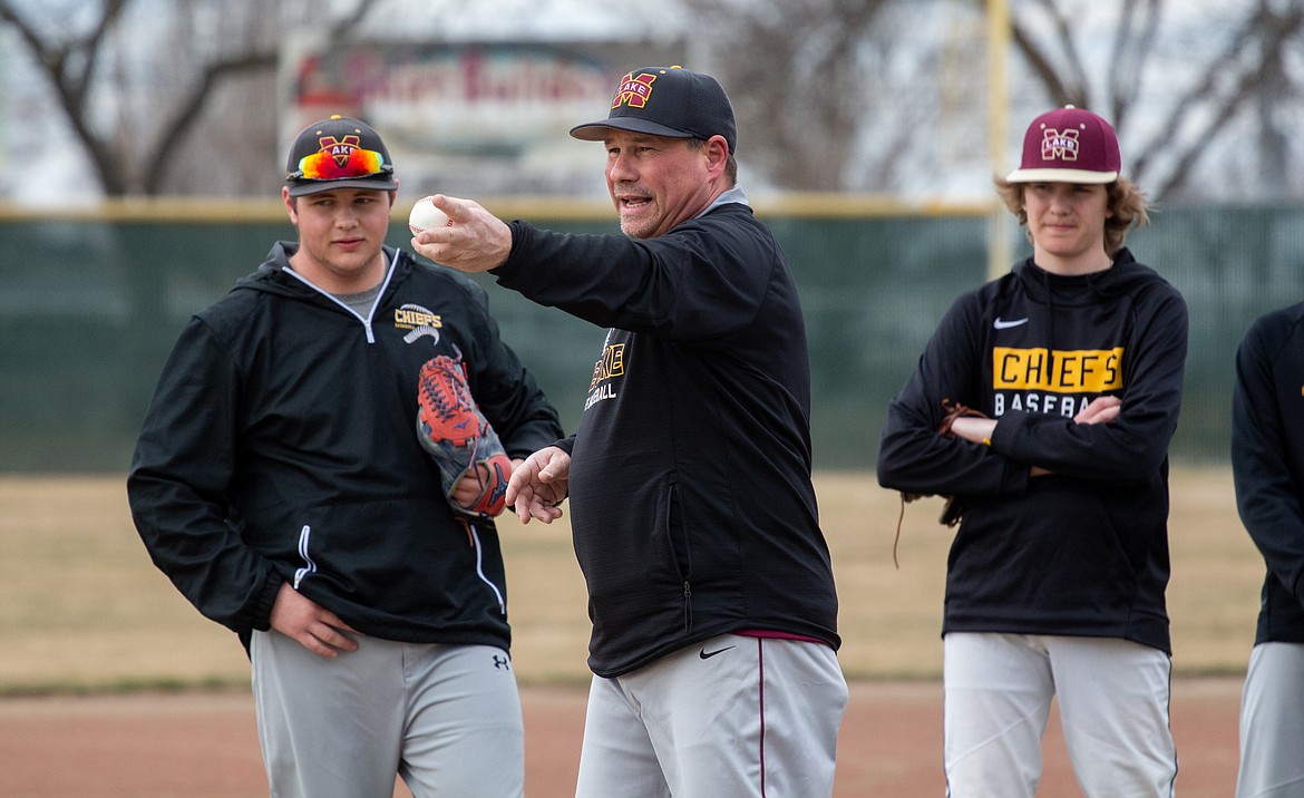 Casey McCarthy/Columbia Basin Herald Moses Lake head coach Donnie Lindgren shouts instruction to his infield players during a drill, as the Chiefs run through different gametime scenarios in practice on Tuesday afternoon at Larson Playfield.
