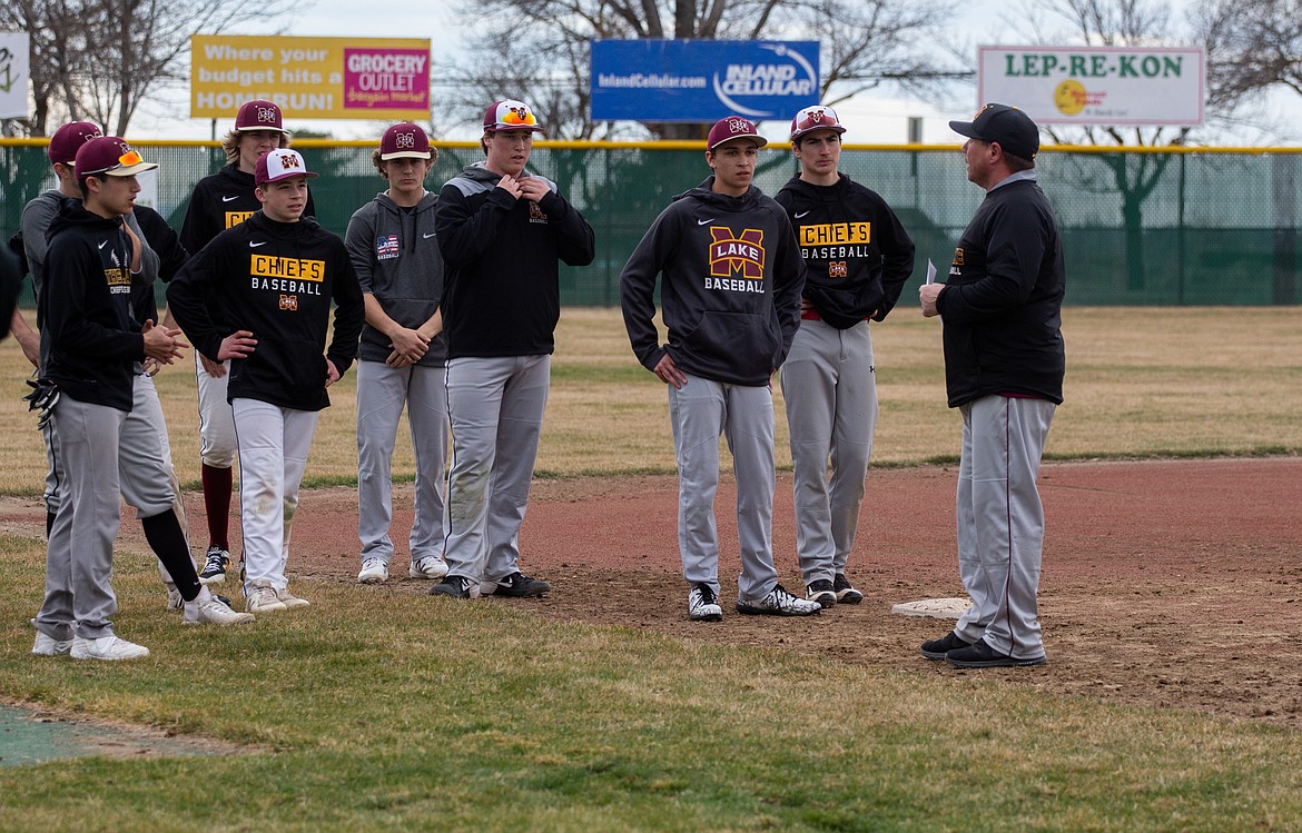 Casey McCarthy/Columbia Basin Herald Moses Lake head coach Donnie Lindgren talks with his team at the beginning of practice on Tuesday afternoon at Larson Playfield as the Chiefs get set for another season on the diamond.