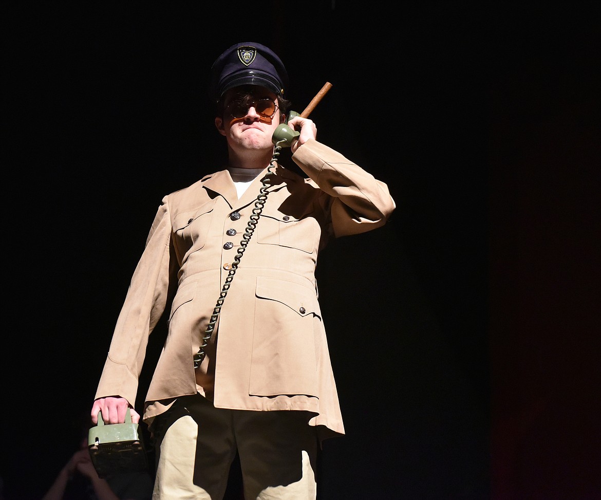 Dashiell Schindler talks on the phone during the opening scene of “MASH” during a dress rehearsal at the Whitefish Performing Arts Center. The Whitefish High School Drama Club preformed the play for audiences last week. (Heidi Desch/Whitefish Pilot)