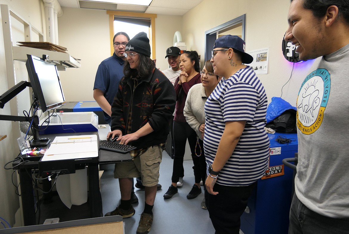 Salish Kootenai College students create fine designs on a laser cutter at the college’s new Advanced Manufacturing Innovation Lab last week. (Carolyn Hidy/Lake County Leader)