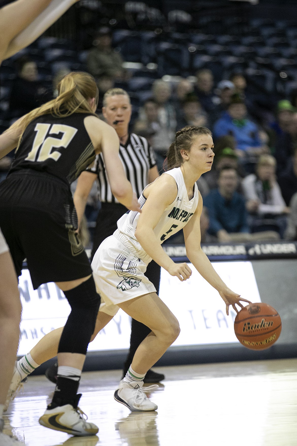 Glacier’s Aubry Grame takes the ball to the top of the key against Billings West in a quarterfinal game of the Class AA State Tournament Thursday, March 12, 2020, at Worthington Arena in Bozeman.  (Ryan Berry/Bozeman Daily Chronicle)