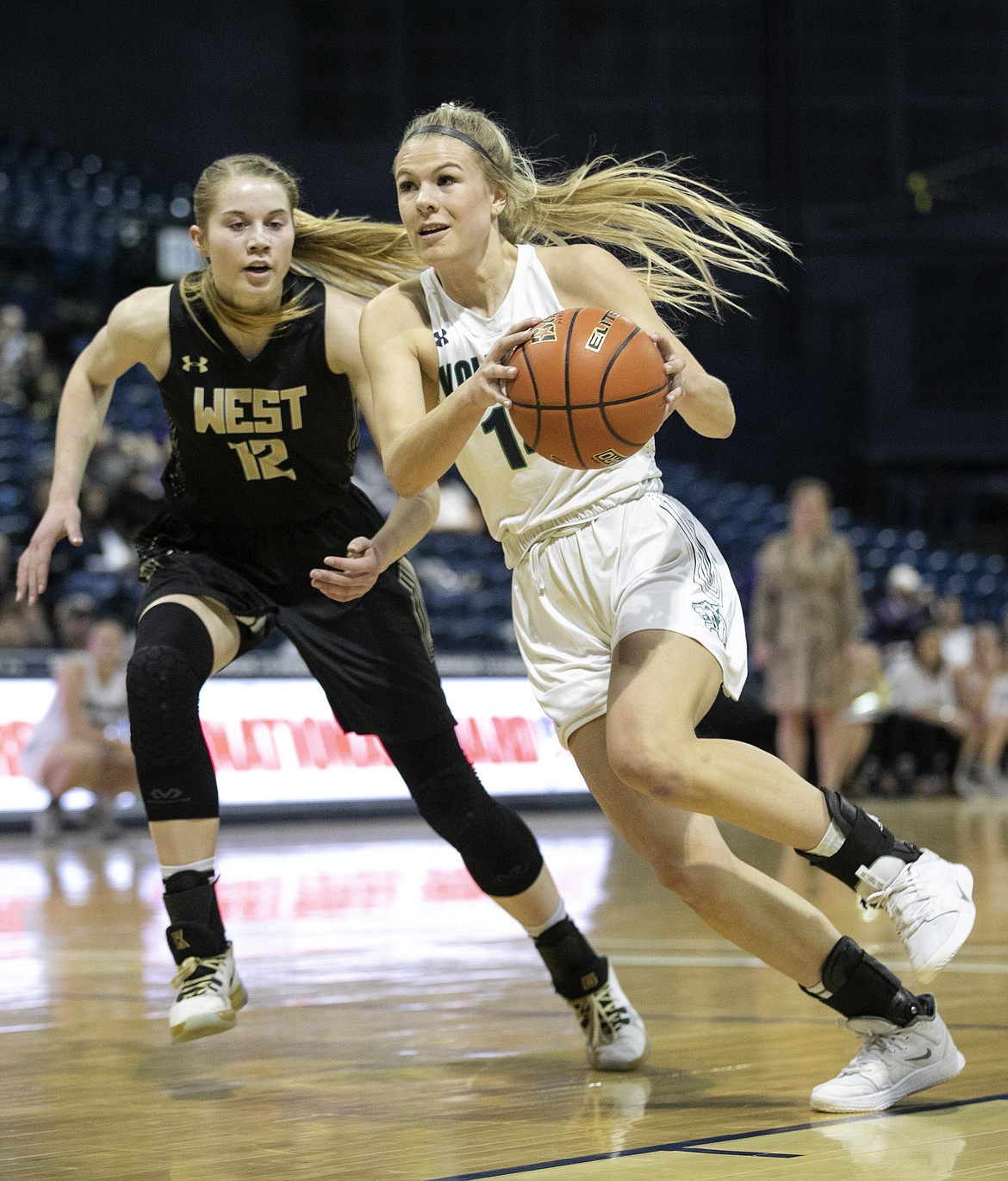 Glacier’s Aubrie Rademacher dribbles down the lane against Billings West in a quarterfinal game of the Class AA State Tournament Thursday, March 12, 2020, at Worthington Arena in Bozeman. (Ryan Berry/Bozeman Daily Chronicle)
